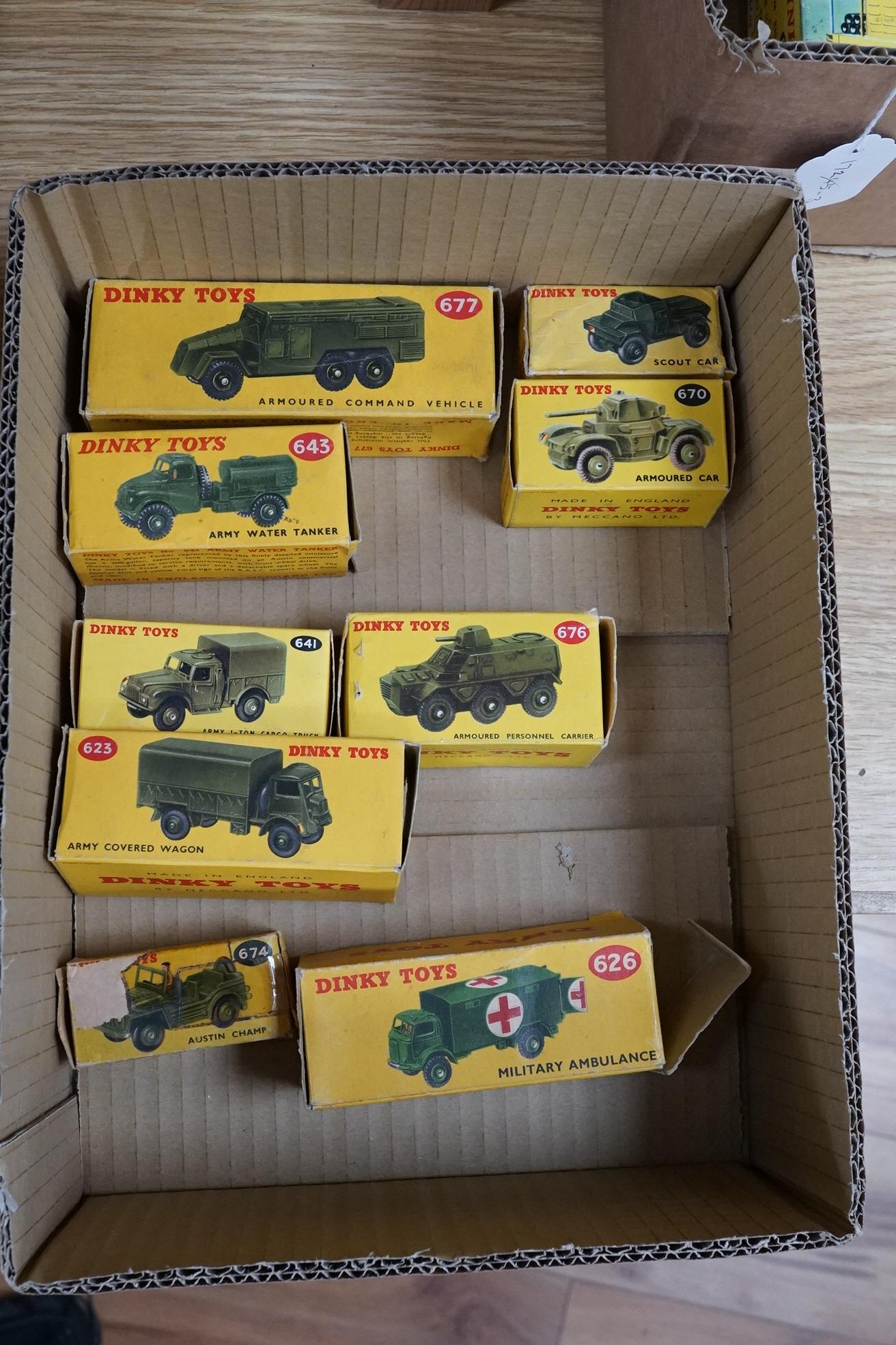 Nine boxed Dinky Toys military vehicles; Armoured Command Vehicle (677), Scout Car (673), Armoured Car (670), Army Water Tanker (643), Army 1-ton Cargo Truck (641), Armoured Personnel Carrier (676), Army Covered Wagon (6